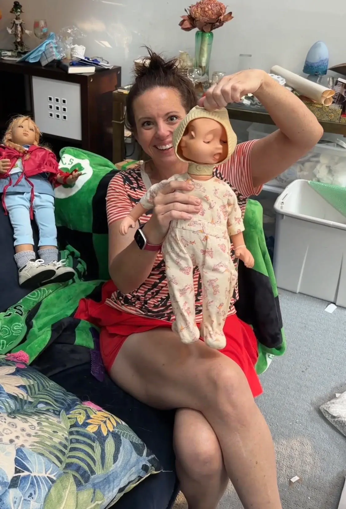 Gwen sorting a collection of vintage baby dolls