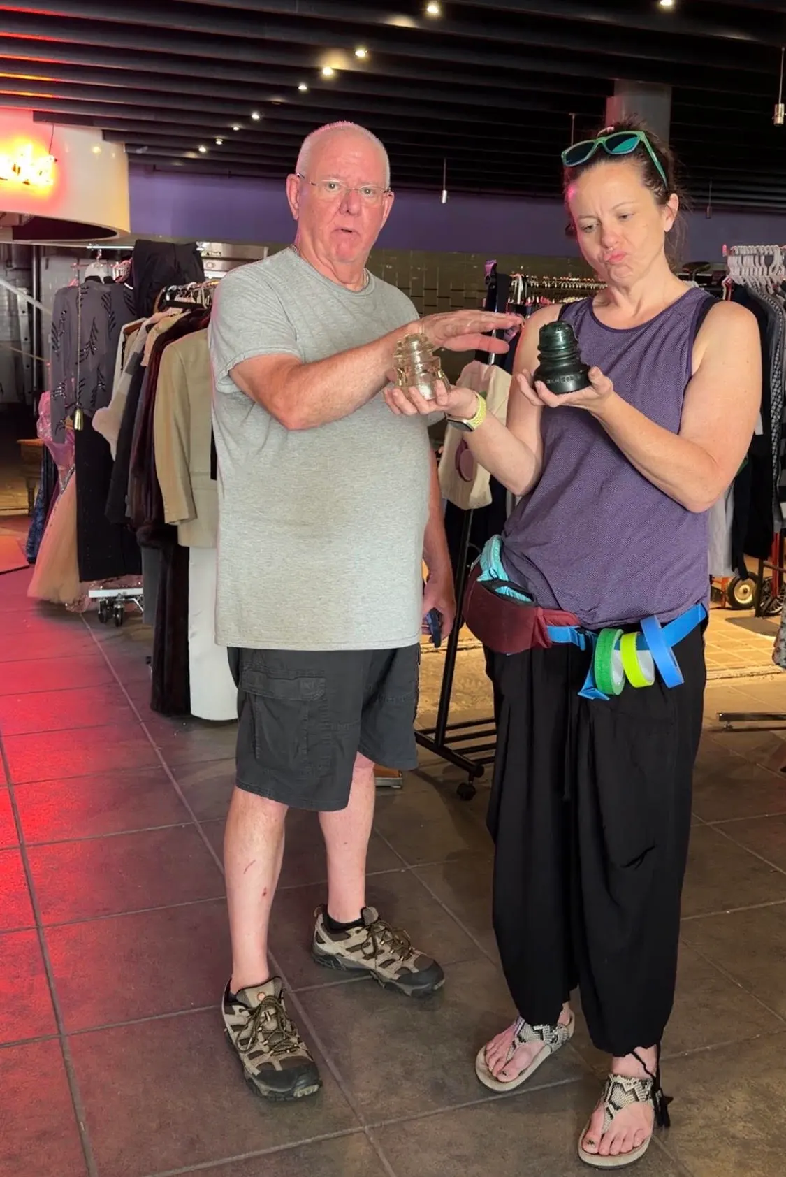 Gwen helping a customer look through items at an estate sale