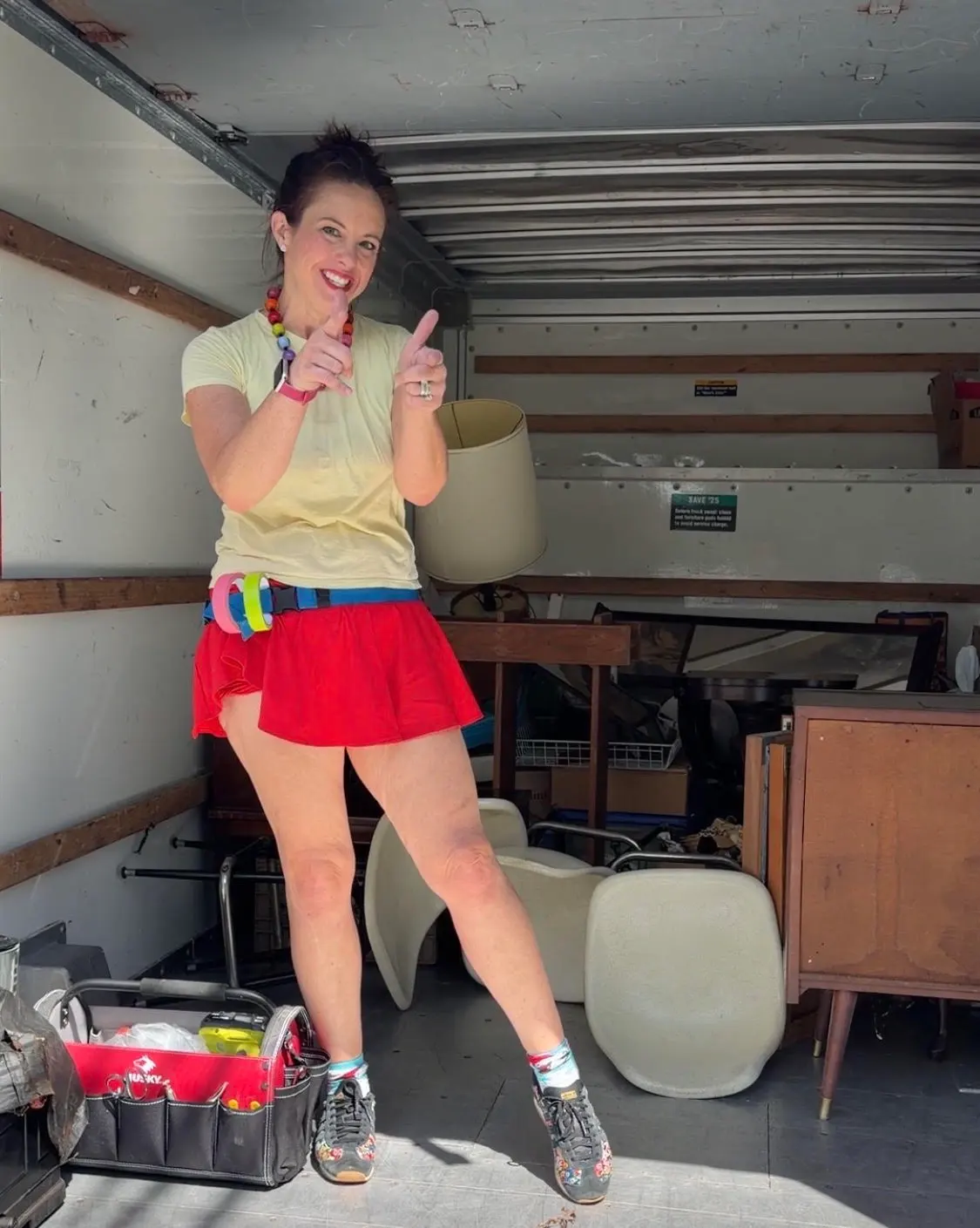 Gwen inside a packed storage unit before a cleanout