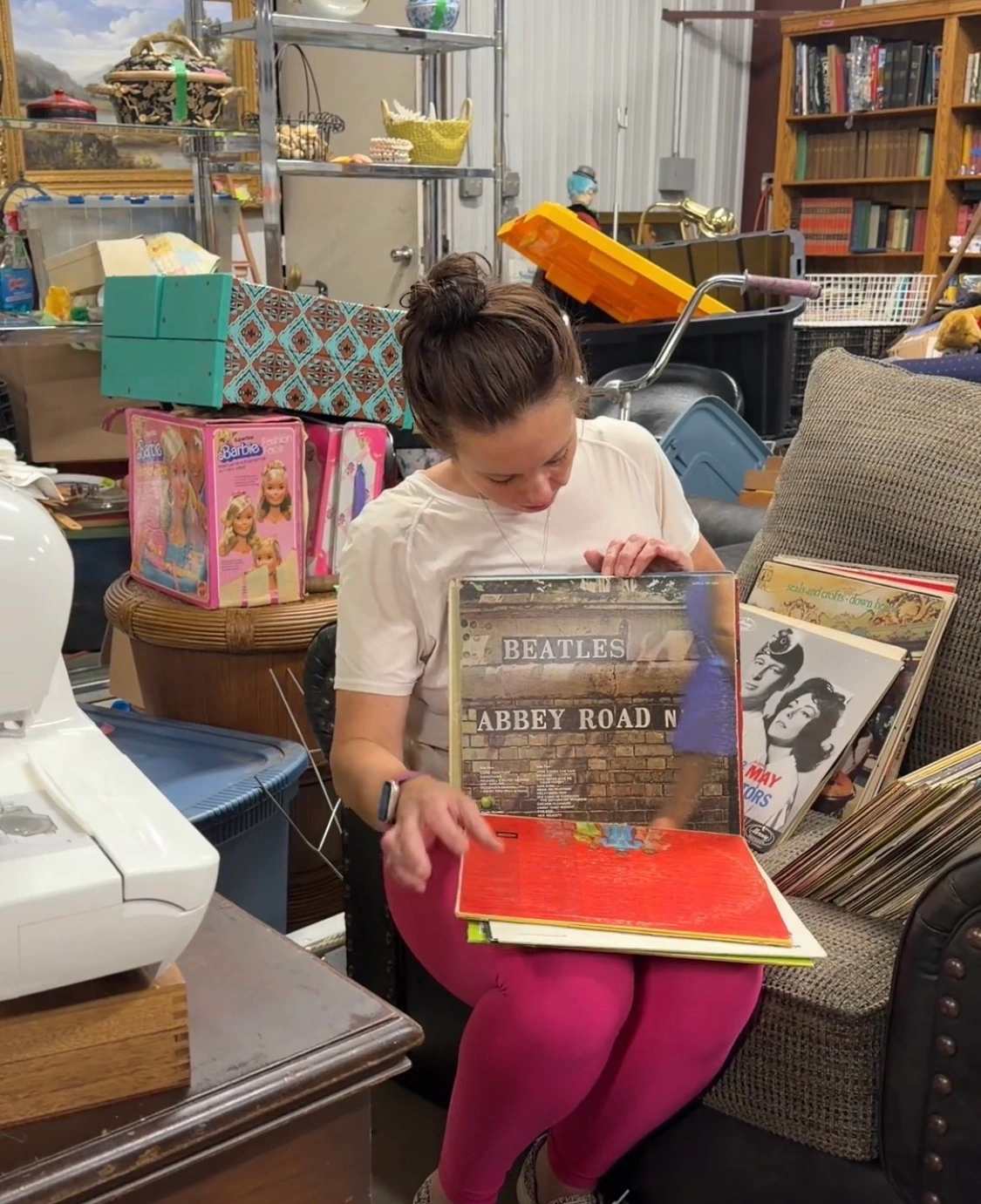 Gwen sharing the story behind a collection of vintage records